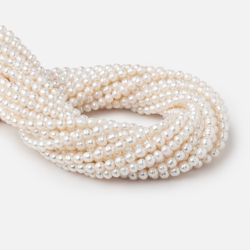 5.5mm Creamy White Ringed Baroque Freshwater Pearls 15 inch 68 Beads